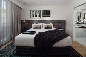 Voodi või voodid majutusasutuse QT Queenstown toas