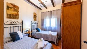 Posteľ alebo postele v izbe v ubytovaní Casa Los Olivos Orgiva by Ruralidays + 12 fotografií