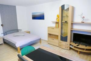 Ein Bett oder Betten in einem Zimmer der Unterkunft Ferienwohnungen Zinnowitz