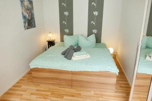 Ein Bett oder Betten in einem Zimmer der Unterkunft Ferienwohnungen Zinnowitz