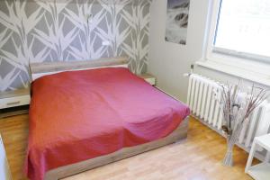 Ein Bett oder Betten in einem Zimmer der Unterkunft Ferienwohnungen Zinnowitz