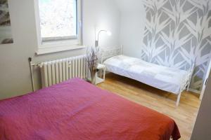 Ein Bett oder Betten in einem Zimmer der Unterkunft Ferienwohnungen Zinnowitz