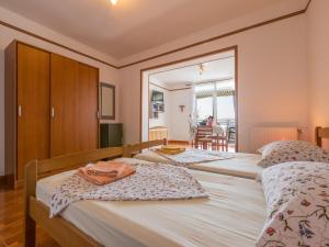 Postel nebo postele na pokoji v ubytování Apartments BEBA