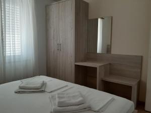 Postel nebo postele na pokoji v ubytování Apartments EDO