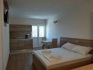 Postel nebo postele na pokoji v ubytování Apartments EDO