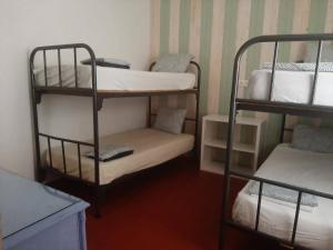 a room with two bunk beds and a chair at Finca El Naranjo in Seville +43 photos