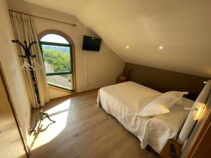 Giường trong phòng chung tại Casa y Apartamento Rural Terra Celta en Salceda de Caselas