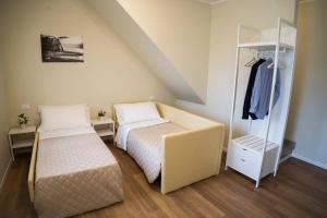 Postel nebo postele na pokoji v ubytování Balconi Del Conero