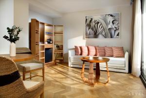 a living room with a couch and a table at TRS Ibiza Hotel - Adults Only in San Antonio