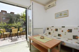 Ruang duduk di Apartments and Rooms Iva