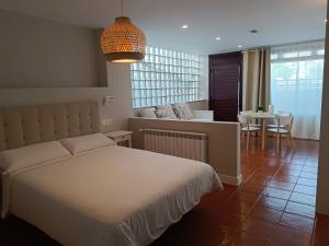 A bed or beds in a room at Apartamentos Marina