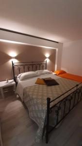 a bedroom with a large bed in a room at La Nicchia del borgo in Taranto +4 photos
