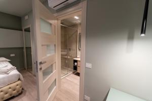 Postel nebo postele na pokoji v ubytování DiVino Rooms Deluxe