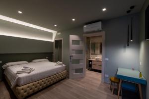 Postel nebo postele na pokoji v ubytování DiVino Rooms Deluxe