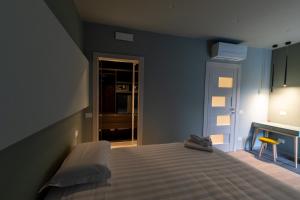 Postel nebo postele na pokoji v ubytování DiVino Rooms Deluxe