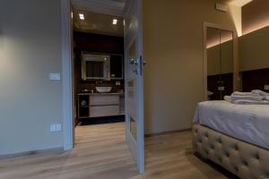 Postel nebo postele na pokoji v ubytování DiVino Rooms Deluxe