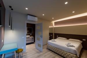 Postel nebo postele na pokoji v ubytování DiVino Rooms Deluxe