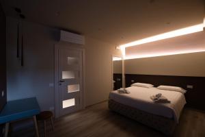 Postel nebo postele na pokoji v ubytování DiVino Rooms Deluxe