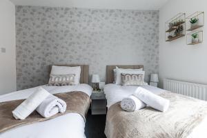 Кровать или кровати в номере Central & Contractors & Leisure House & Spacious