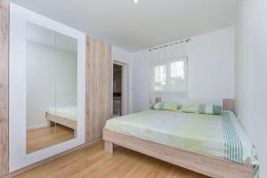 Posteľ alebo postele v izbe v ubytovaní Apartment Marijo + 16 fotografií