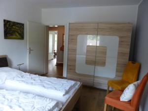 Cama o camas de una habitación en Ferienwohnung Jano - Residenz am See