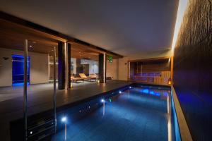 a swimming pool in the middle of a house at Nakar Hotel in Palma de Mallorca