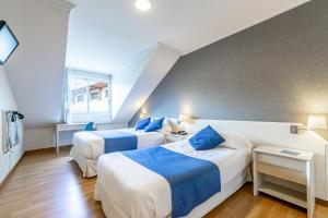 Voodi või voodid majutusasutuse Hotel Atlántico Vigo toas