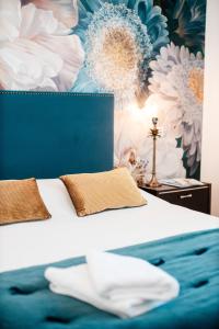 Posteľ alebo postele v izbe v ubytovaní Les Précieuses Suites & Spa II