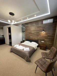 Ліжко або ліжка в номері Levanevsky Hotel