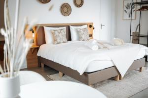 Uma cama ou camas num quarto em Hotel Paradis Zandvoort