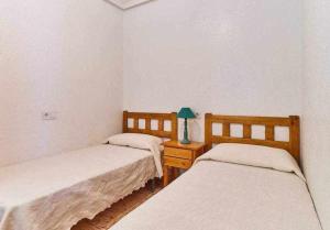 Łóżko lub łóżka w pokoju w obiekcie Espanhouse Diego apartment