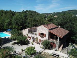 an external view of a house and a swimming pool at MAS LE CORBERY in Largentière
