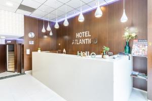 a lobby with a hotel atlantic sign on the wall at Hotel Atlántico Vigo in Vigo