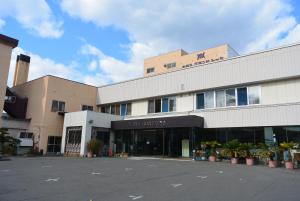 a building with a parking lot in front of it at Hotel Grand Toya in Lake Toya +60 photos
