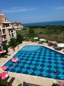 an overhead view of a swimming pool at a resort at Byala COZY APARTMENT in Byala +11 photos