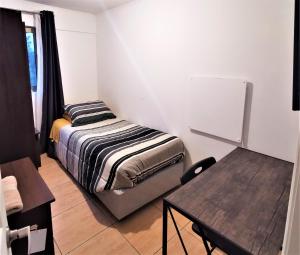 Кровать или кровати в номере Hostal Vivo Concepción