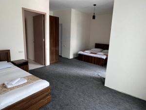 Postel nebo postele na pokoji v ubytování Guest House Nikola