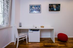 TV o dispositivi per l'intrattenimento presso Guesthouse Old Mulberry