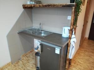 Kuchyň nebo kuchyňský kout v ubytování Garni