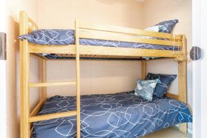 a couple of bunk beds in a room at Le Valet in Saint-Cast-le-Guildo