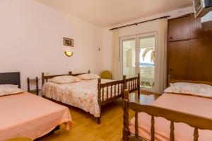 Postel nebo postele na pokoji v ubytování Apartments Jerkunica