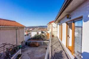 an apartment balcony with a view of a city at Apartments Josip in Novi Vinodolski
