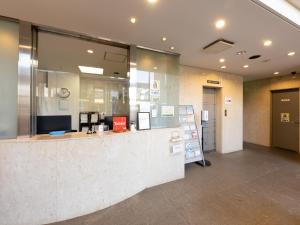 a lobby of a store with a reception counter at Tabist Urban Stays Asakusa in Tokyo