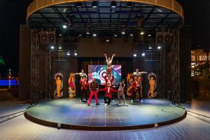 a group of people on a stage at night at AQI Hydros Club in Kemer