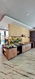a kitchen with a counter with dishes on it at Yesil Kosk Hotel in Uzungöl