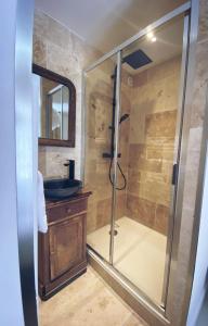 a bathroom with a shower and a sink at Hôtel Restaurant "La Petite Auberge" in Bourg-Saint-Maurice