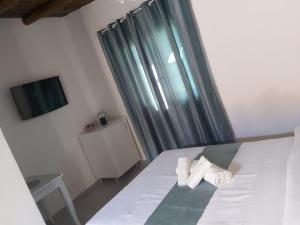 A bed or beds in a room at Il Siriaco
