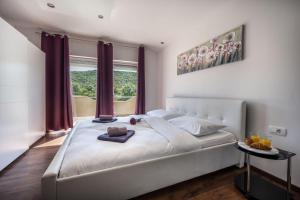 Ένα ή περισσότερα κρεβάτια σε δωμάτιο στο Villa JULIJA +48 φωτογραφίες