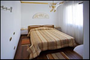 Postel nebo postele na pokoji v ubytování B&B Oasi di Venezia + 13 fotografií