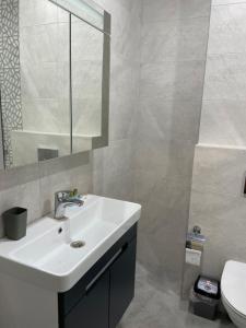 Koupelna v ubytování Hotel Biota